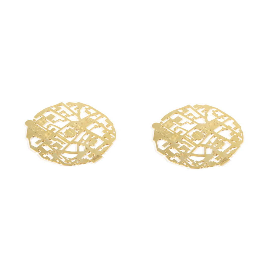 The pair of Roma brass coasters, cut with the plan of Rome