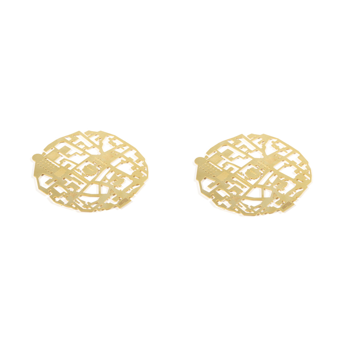 The pair of Roma brass coasters, cut with the plan of Rome